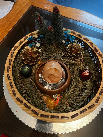Centre de table avec bougie de Noël.