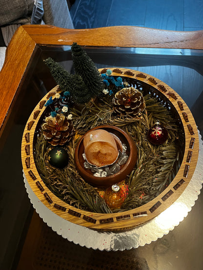 Centre de table avec bougie de Noël.