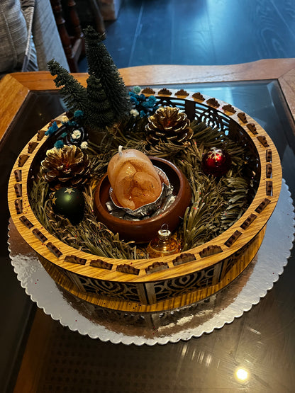 Centre de table avec bougie de Noël.